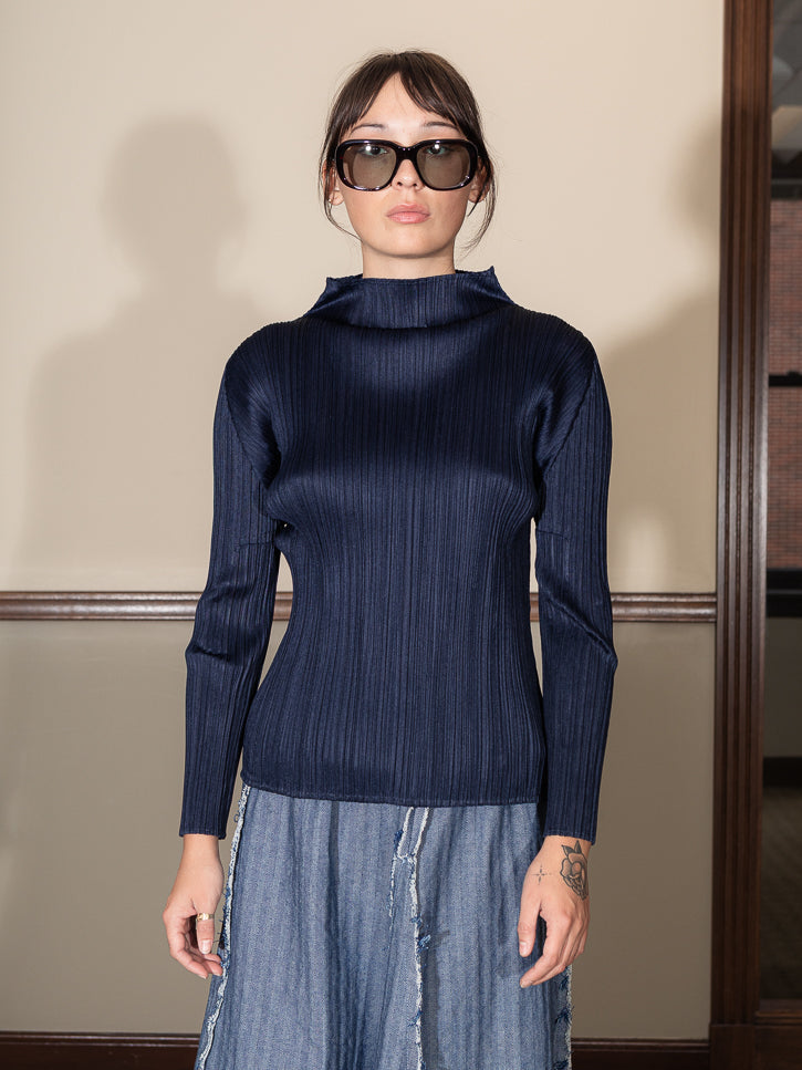 Issey Miyake Classic Long Sleeve Mock Neck Top, Navy | Stand Up Comedy